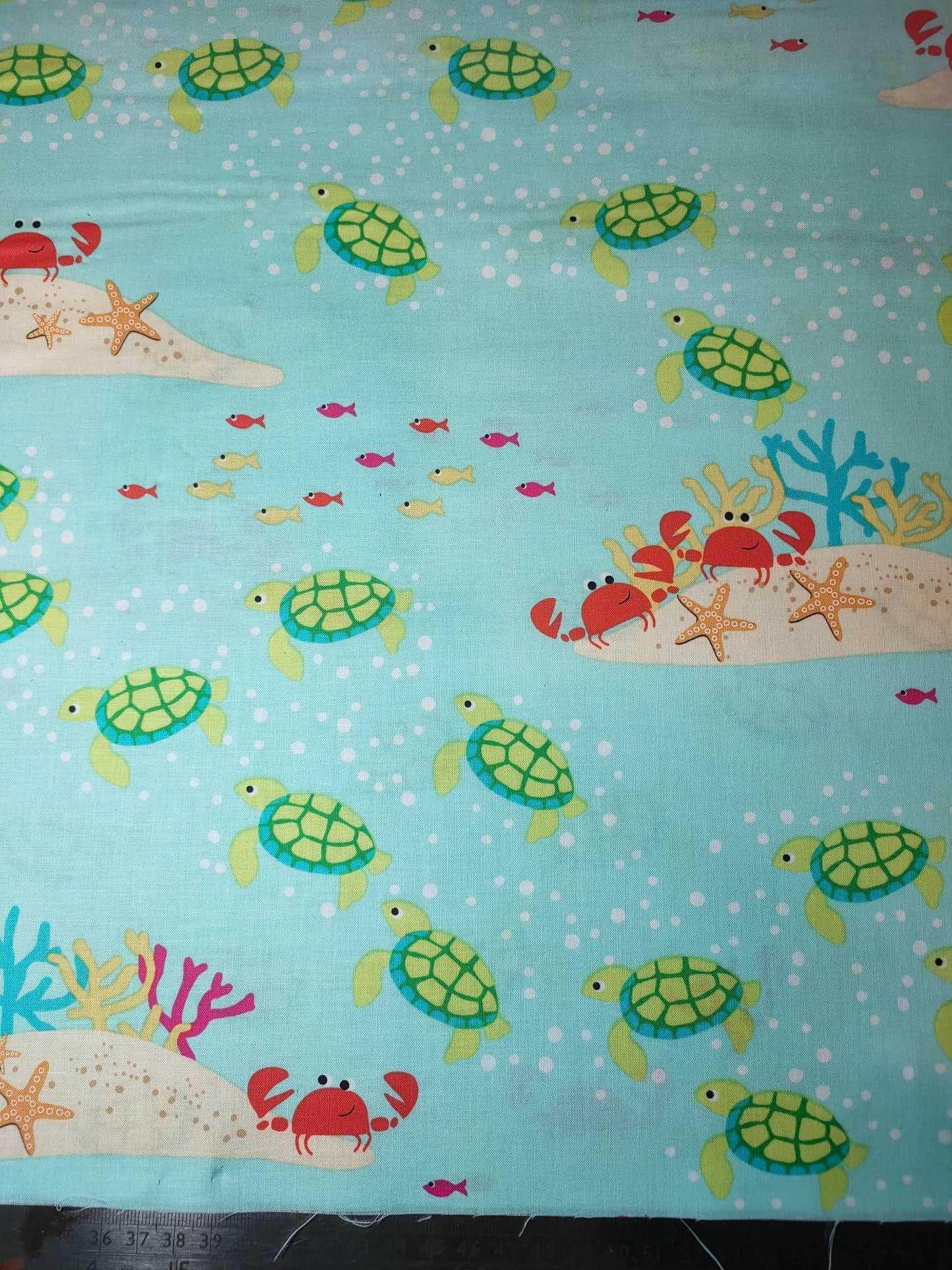 Michael Miller Meetin At The Reef 100% cotton fabric. Fat Quarter. Turles, fish and crabs on a aqua background.