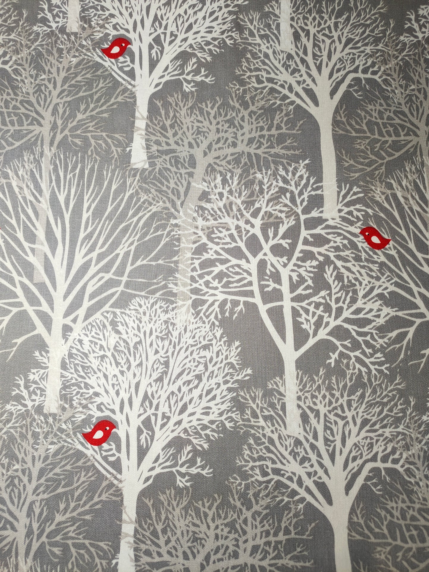 Michael Miller Woodland Winter 100% cotton fabric. Fat Quarter. White trees with red bird on a grey background.