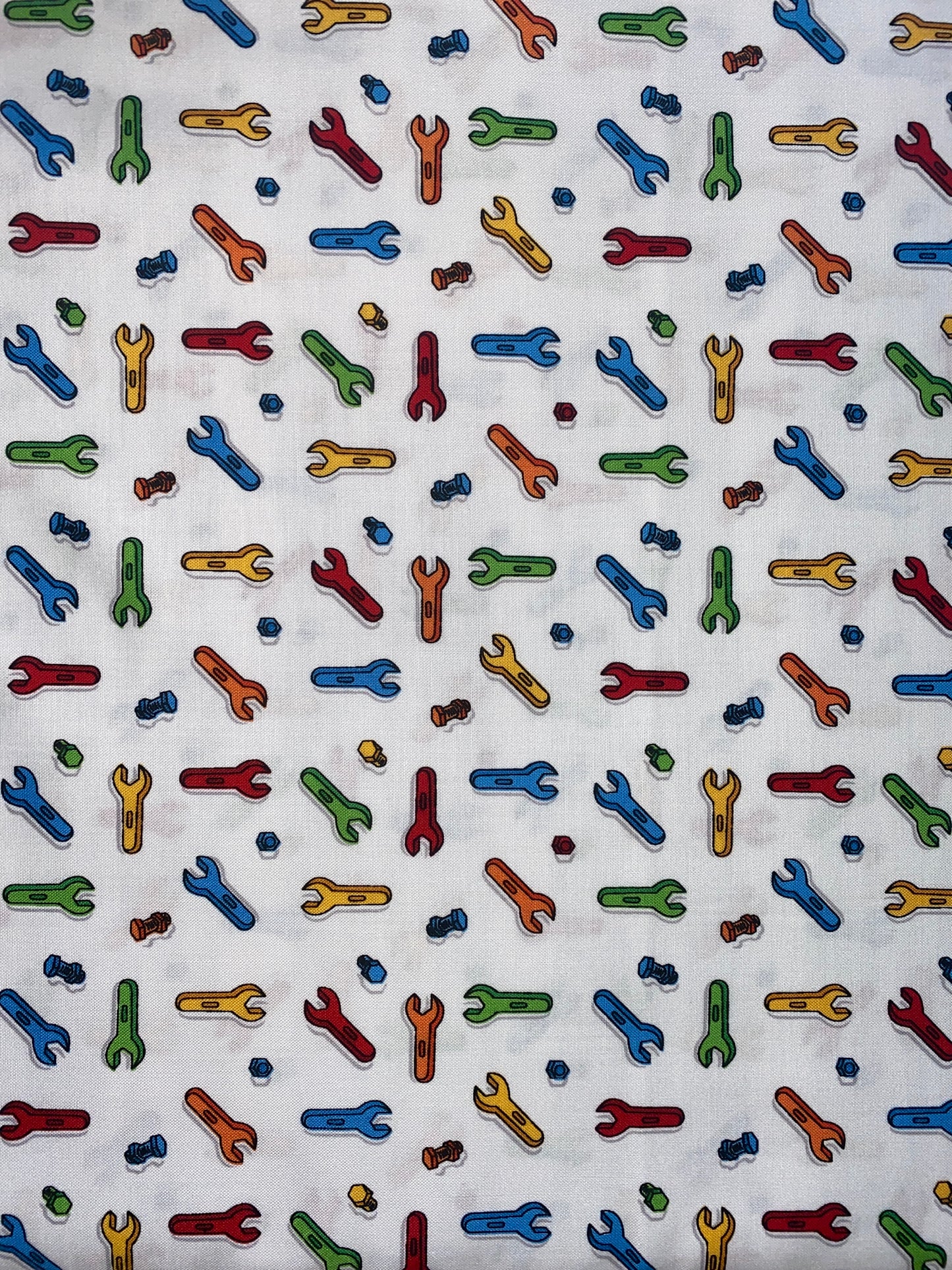 Michael Miller Nuts and bolts 100% cotton fabric. Fat Quarter. Spanners and bolts on a white background.