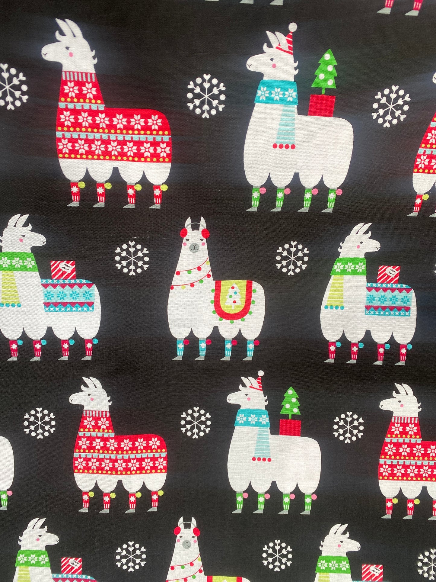 Michael Miller Llama Navidad 100% cotton fabric. Fat Quarter. Christmas llamas in jumpers and hats on a black background.
