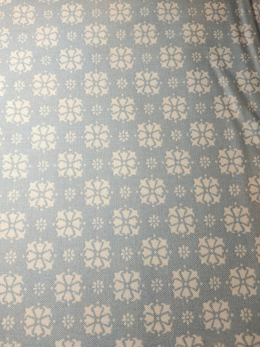 Moda Puttin On The Ritz 100% cotton fabric. Fat Quarter.  White pattern on a pale blue background.