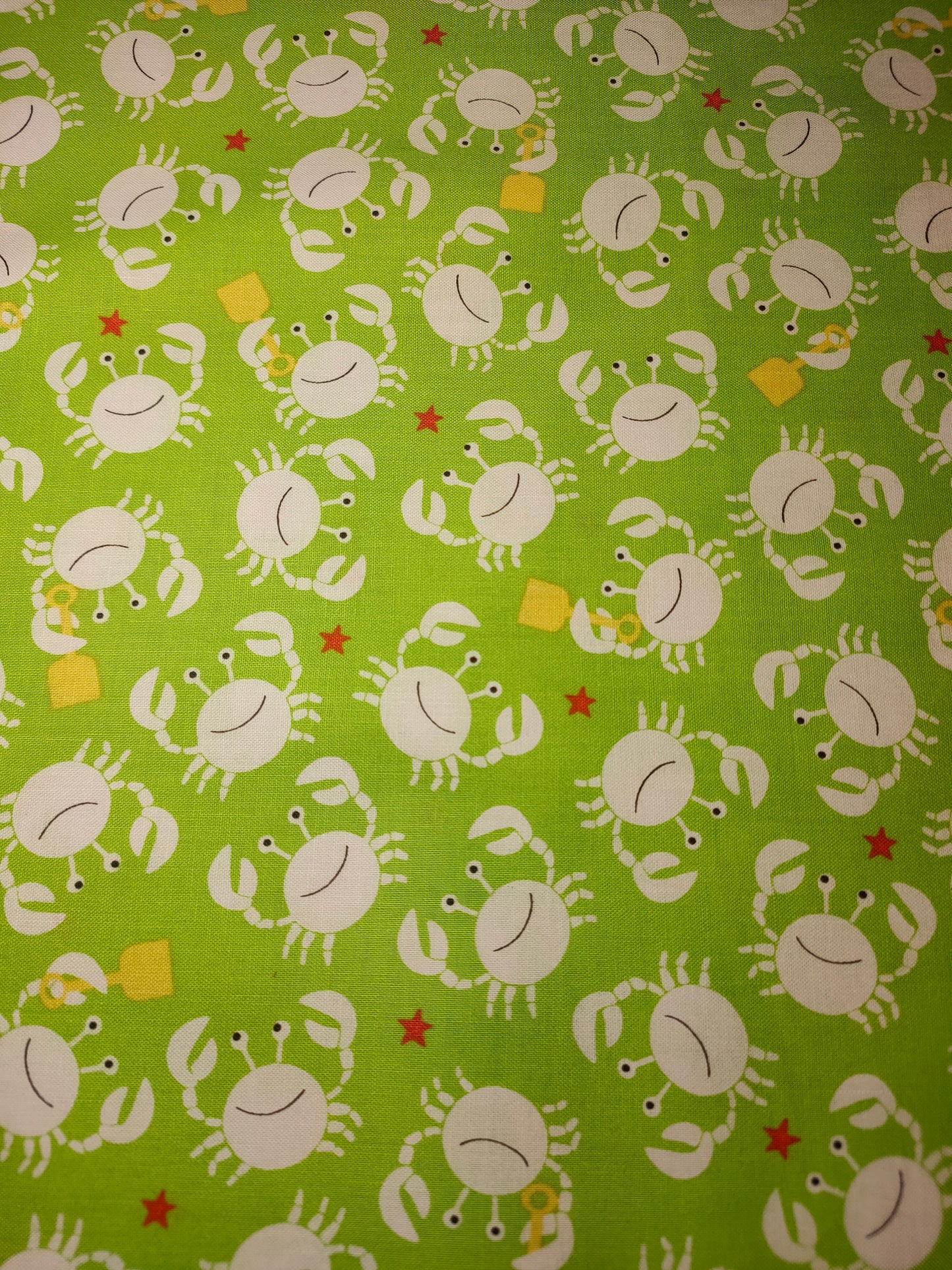 Michael Miller Little Diggers 100% cotton fabric. Fat Quarter.  White crabs on a lime green background.