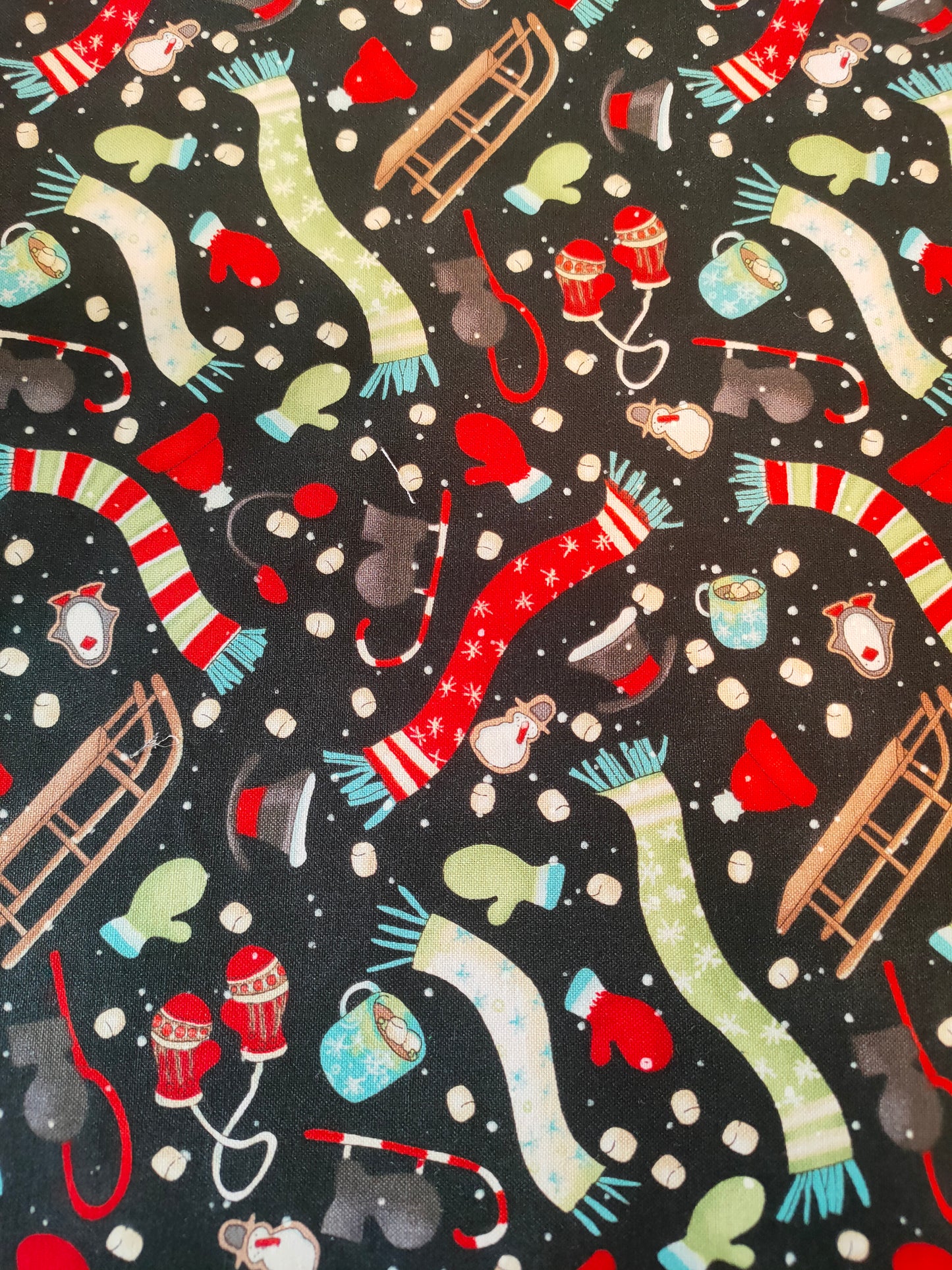 Studio e Silly Chilly Snowmates 100% cotton fabric. Fat Quarter. Hats, gloves, scarfs, sledges on a black background.