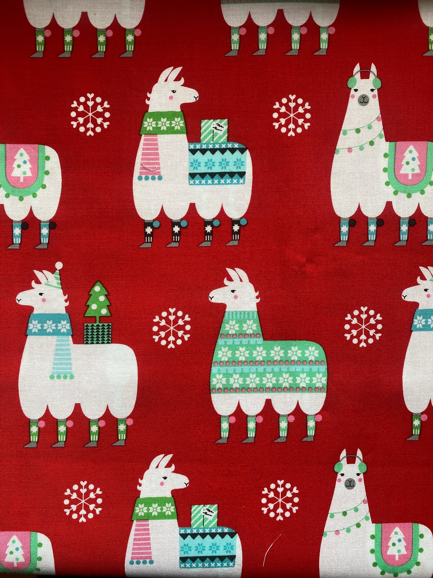 Michael Miller Llama Navidad 100% cotton fabric.  Fat Quarter.  Christmas llamas in jumpers and hats on a red background.