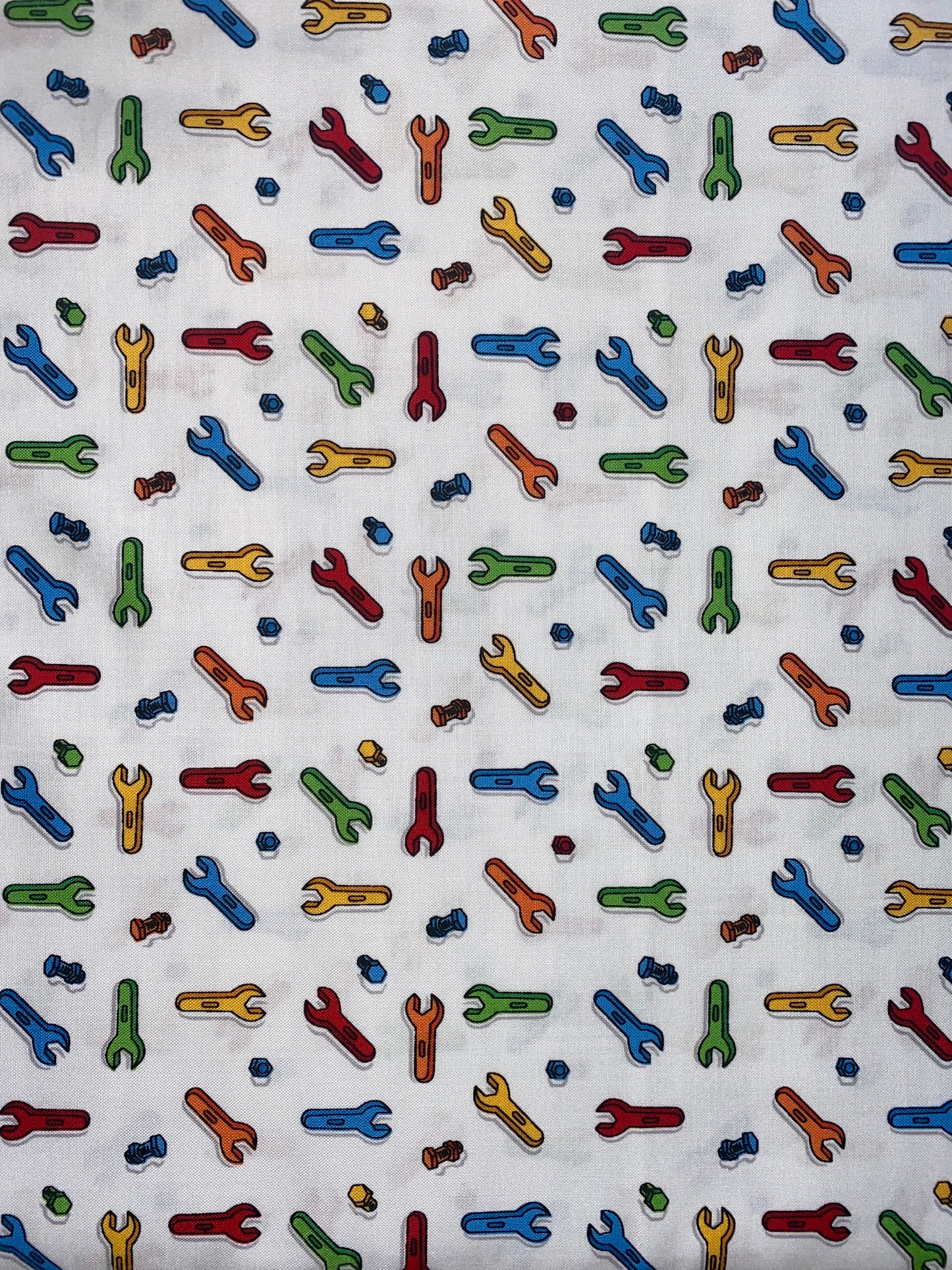 Michael Miller Nuts and bolts 100% cotton fabric. Fat Quarter.  Spanners and bolts on a white background.