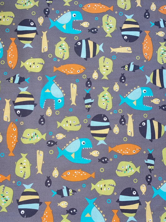 Michael Miller Piranhas 100% cotton fabric. Fat Quarter.  Piranhas and fish on a grey background.